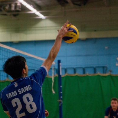 A student playing volleyball