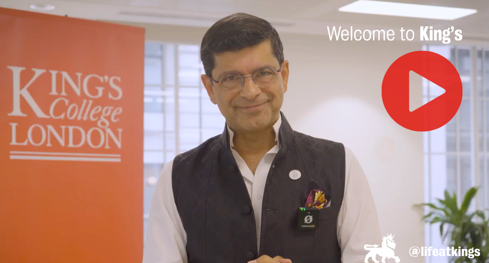 A video still of Professor Shitij Kapur smiling overlaid with a play button