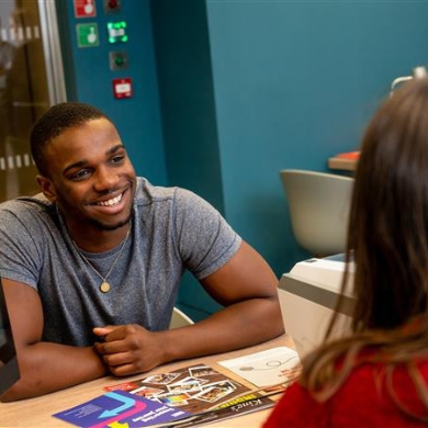 Student getting support at a helpdesk.