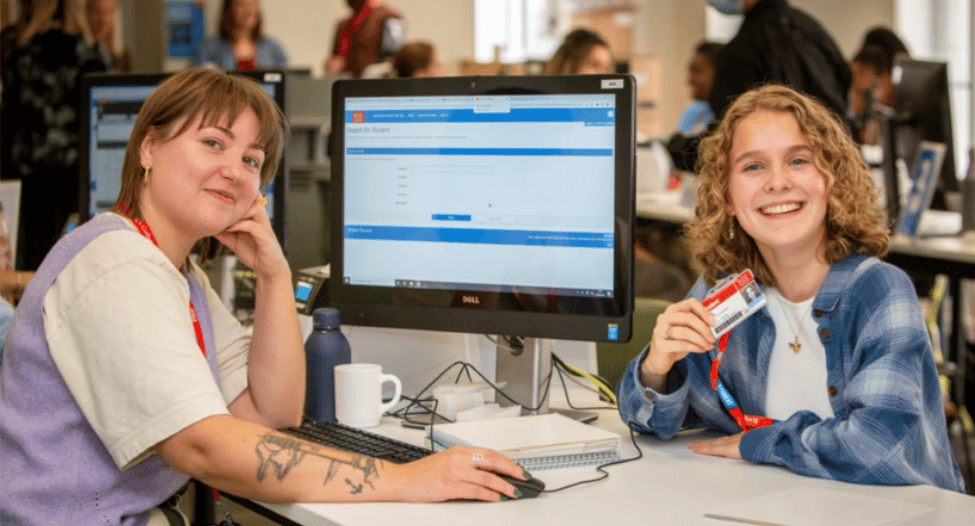 A King's student receiving their new student ID card.