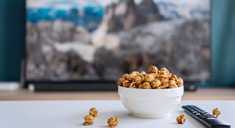 Caramel popcorn in a white bowl