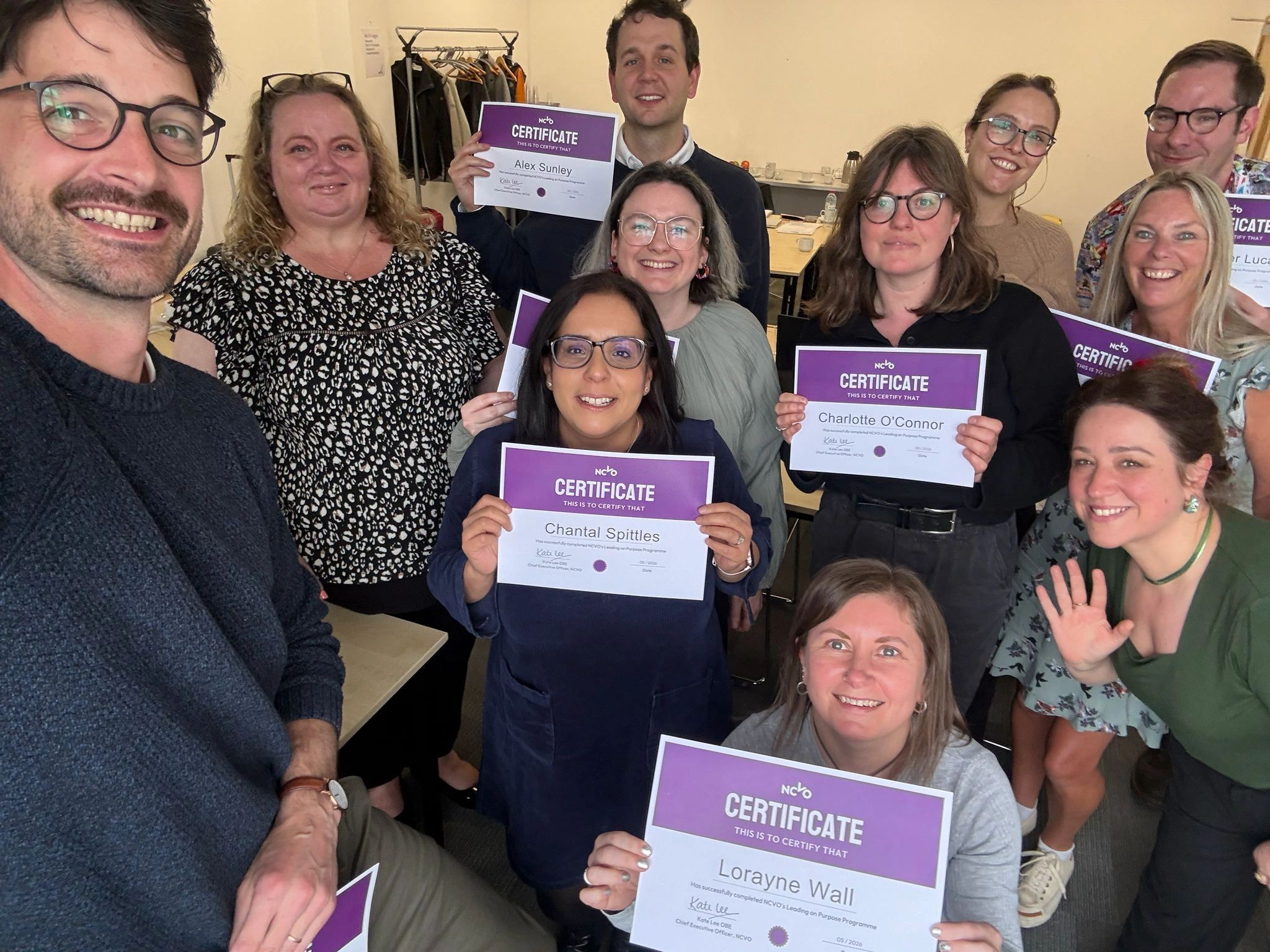 Leading on Purpose training course participants with their certificates