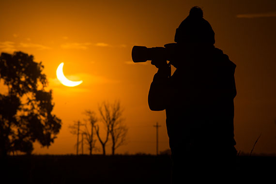 Tourist watching an eclipse