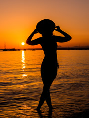 Tourist at sunset on a beach in Majorca