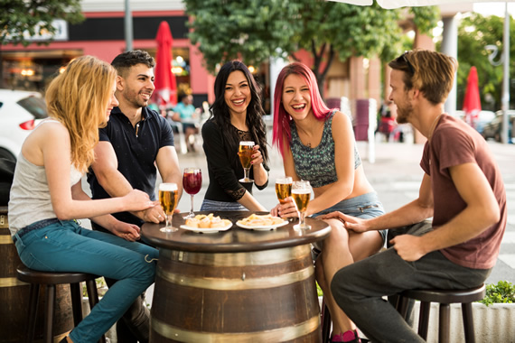 Group of friends having fun at a bar