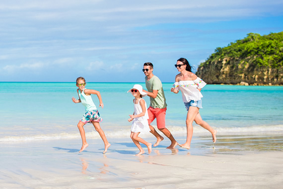 Family vacationing on the beach