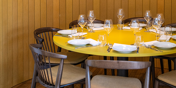Break yellow round table with brown Newood chairs