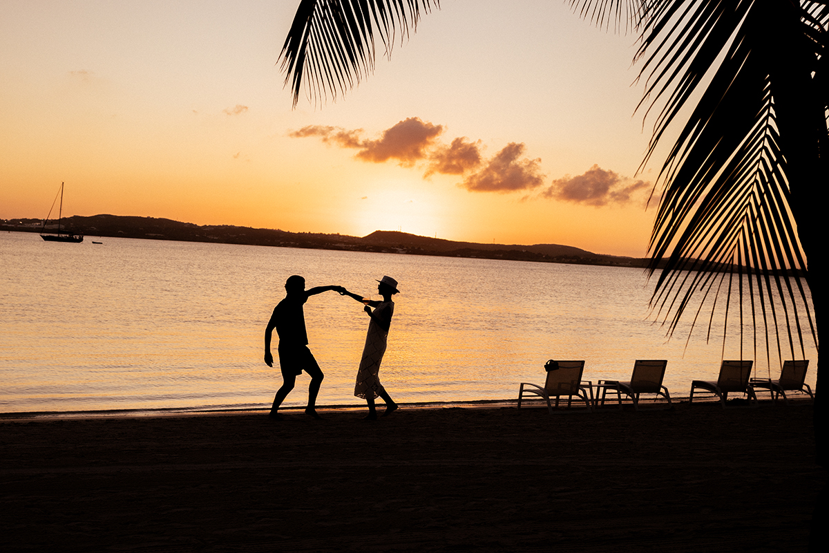 Dancing couple at Sunset on Jumby Bay Beach