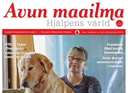 Avun maailma -lehden kantta, jossa näkyy ihminen ja koira.