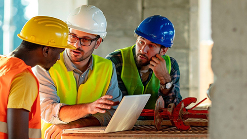 construction workers with laptop
