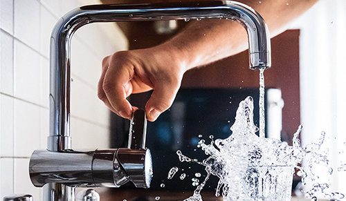 water tap, water and glass