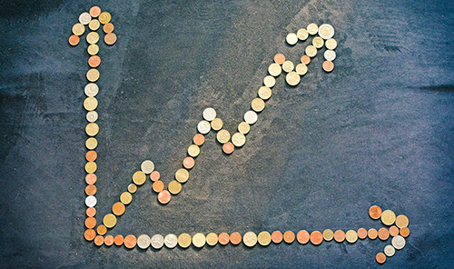 Coins forming an upward arrow